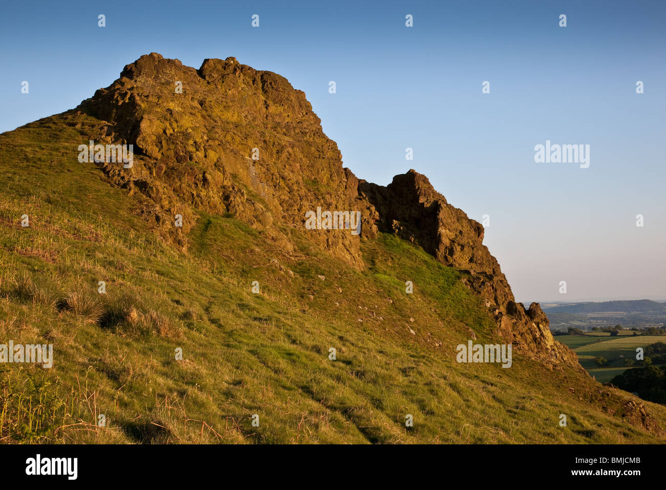 The Gaerstone on Hope Bowdler Hill near Church Stretton, Shropshire, England, in the early evening sunshine Stock Photo