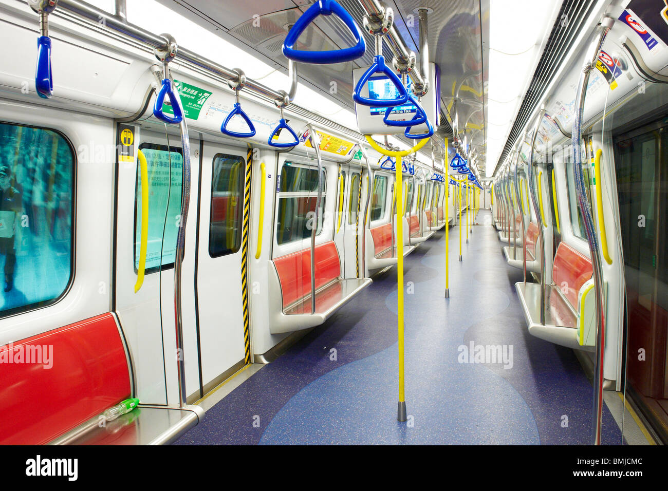 Empty underground train carriage captured in Hong Kong, the fourth most densely populated place in the world. Stock Photo