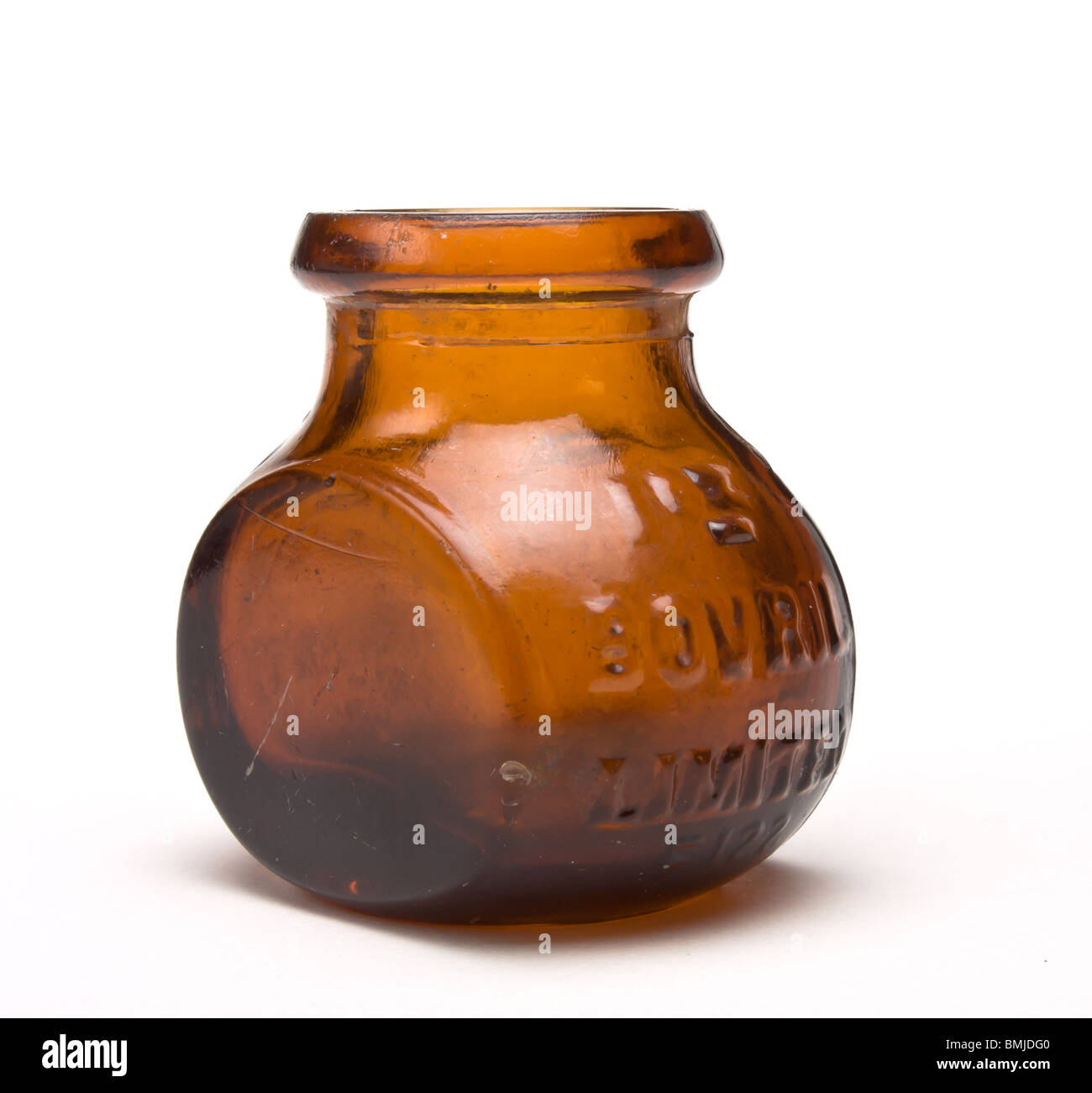 Vintage 1oz Bovril jar against white background brown glass bottle low perspective Stock Photo