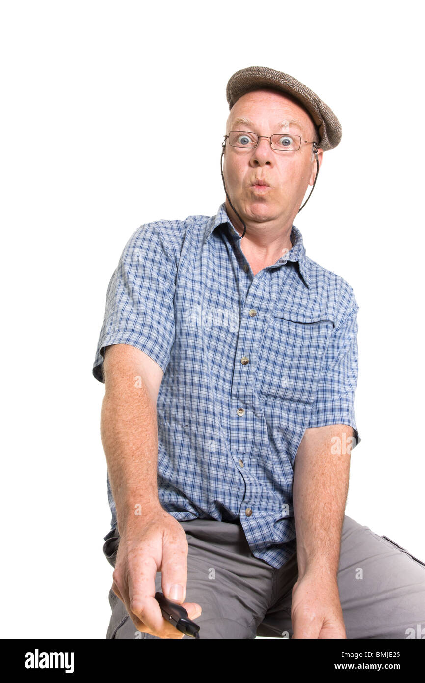 Expressive old man operating remote switch isolated against white ...