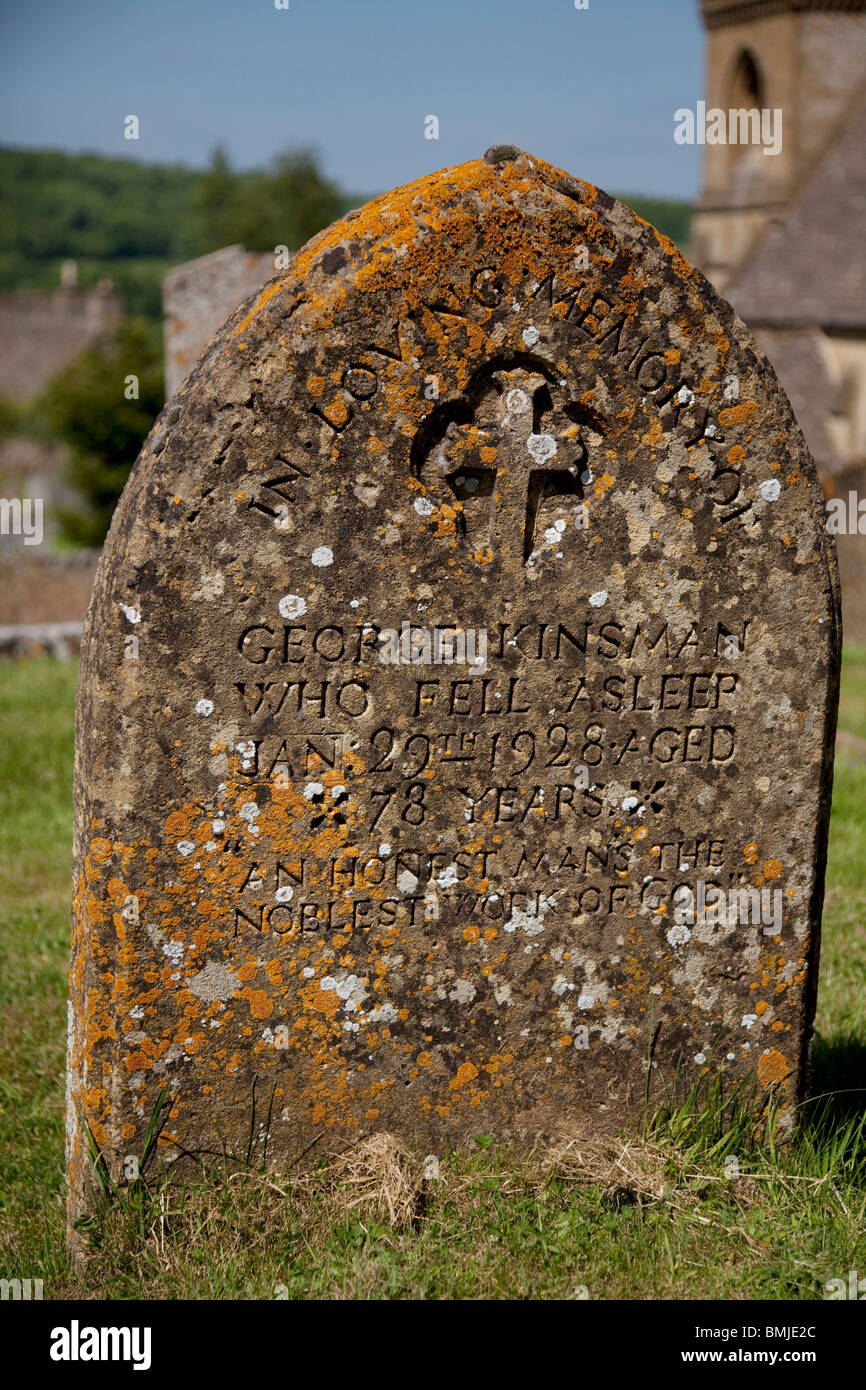 Grave stone in the church yard of the Church of St. Barnabas in Snowshill. The Cotswolds, Gloucestershire, UK. Stock Photo