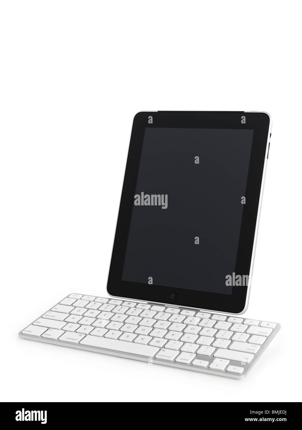 Apple iPad 3G tablet computer with a keyboard dock accessory isolated