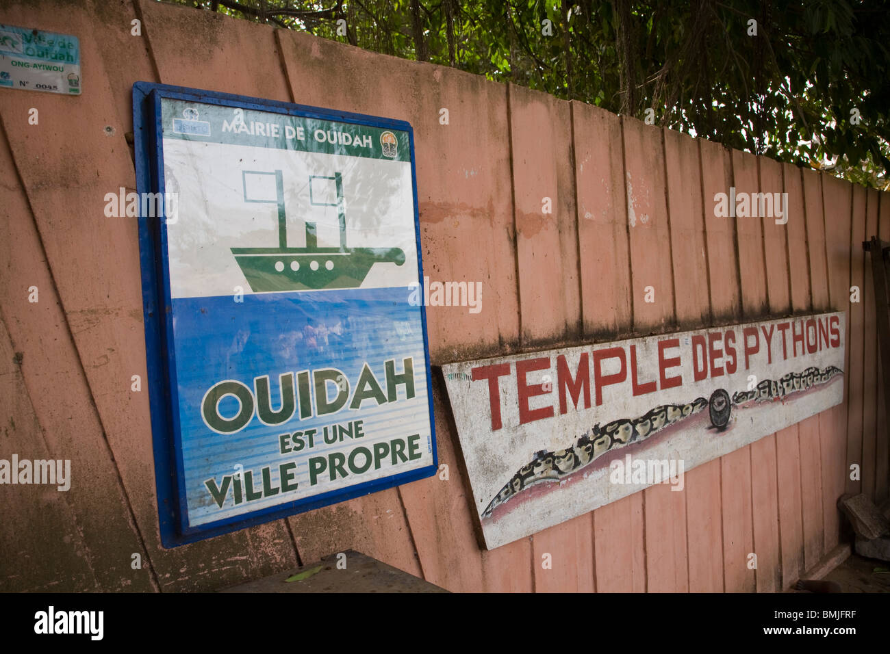 Africa, West Africa, Benin, Ouidah, Temple of the Pythons. Signs along fence at Temple of the Pythons in Ouidah. Stock Photo