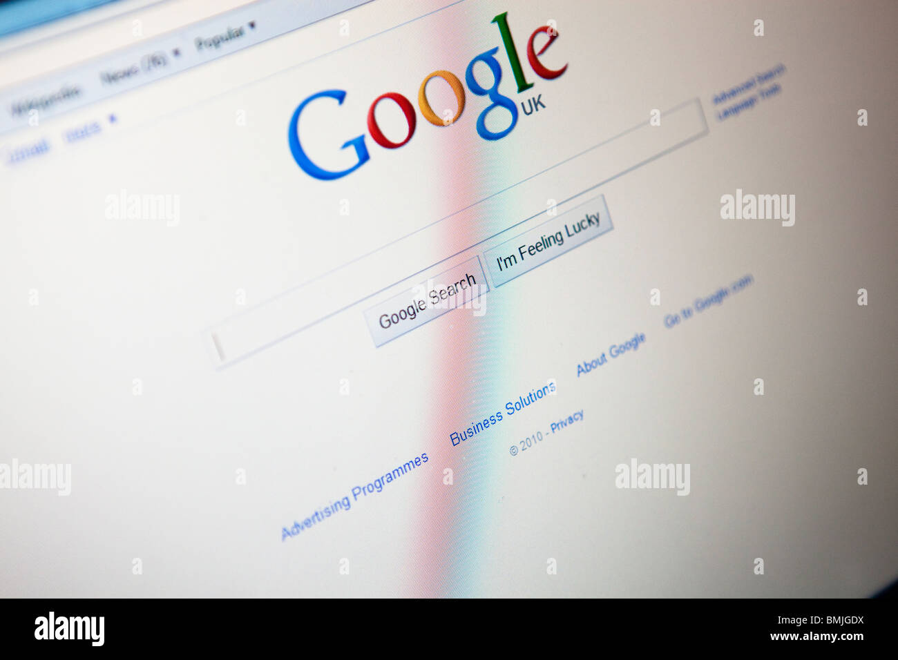 Close up of a computer monitor / screen showing the Google search engine website Stock Photo