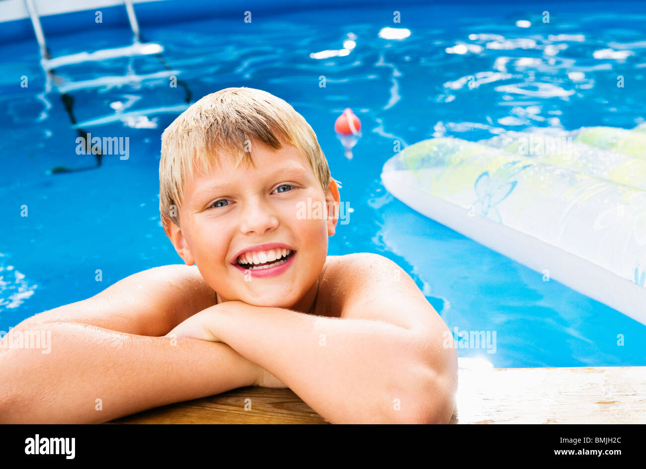 Boy bathing in outdoor pool Stock Photo Alamy