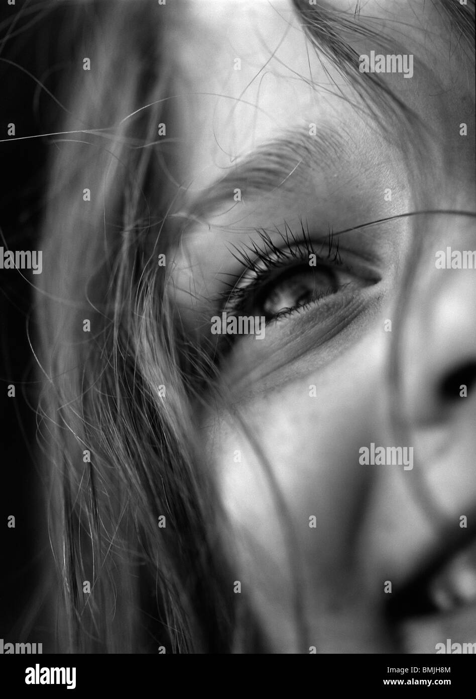 Girl smiling with hair falling on her face Stock Photo Alamy