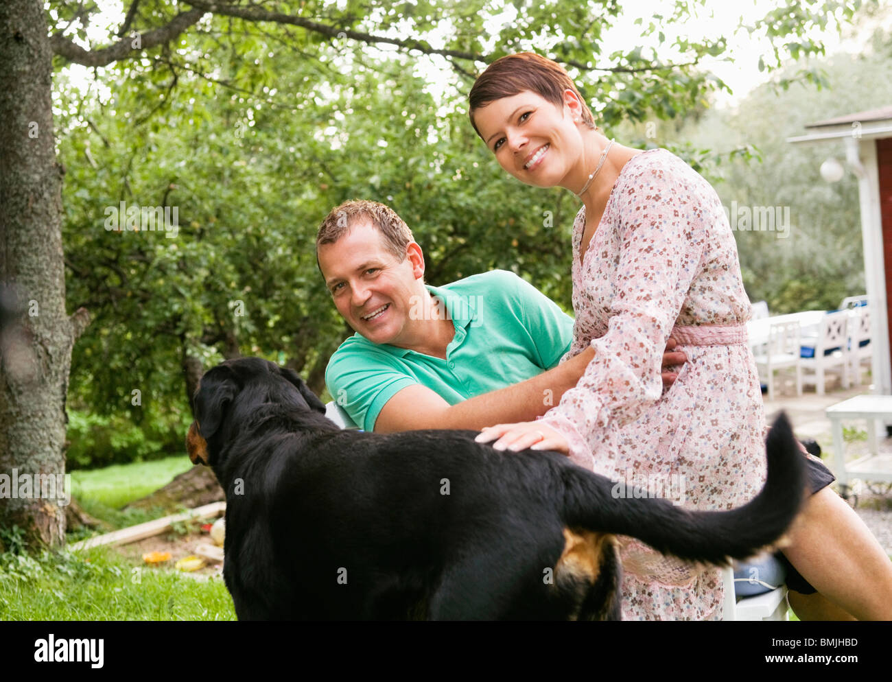 Woman and man with dog Stock Photo