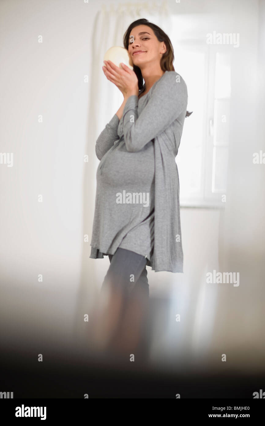 Careful pregnant young woman hi-res stock photography and images - Alamy