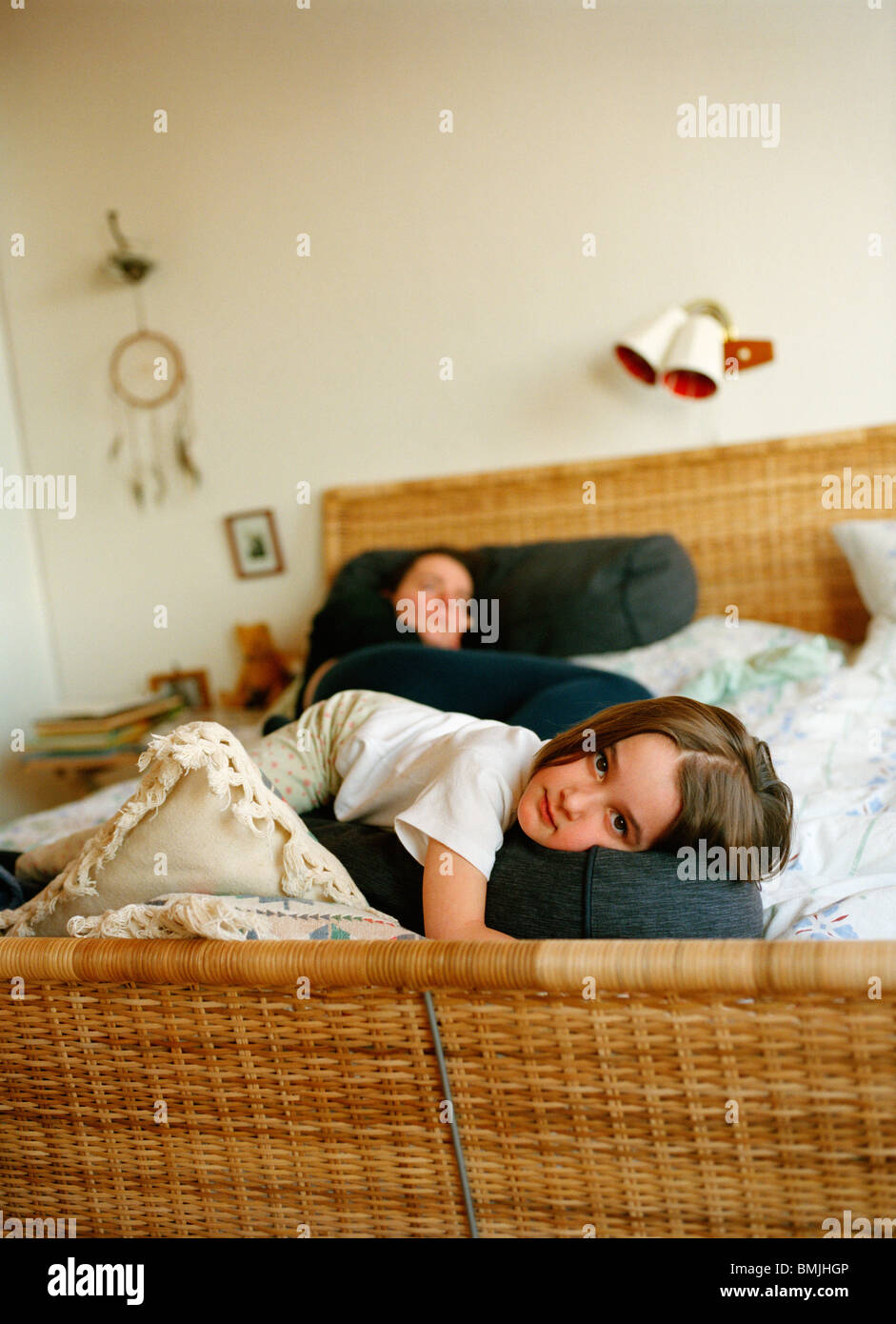 Mother and daughter lying in bed, Sweden Stock Photo Alamy
