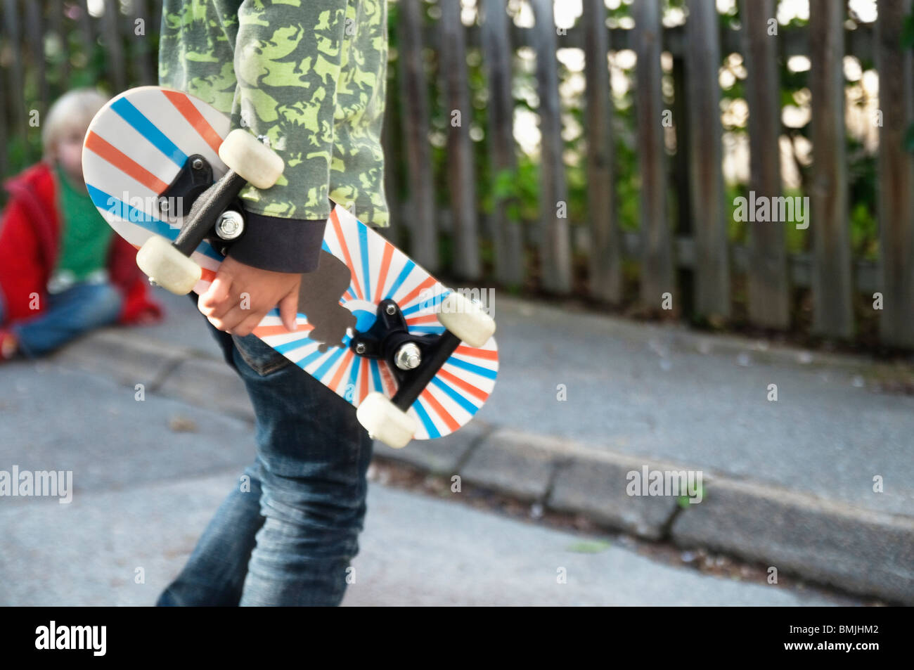 Boy with skateboard Stock Photo Alamy