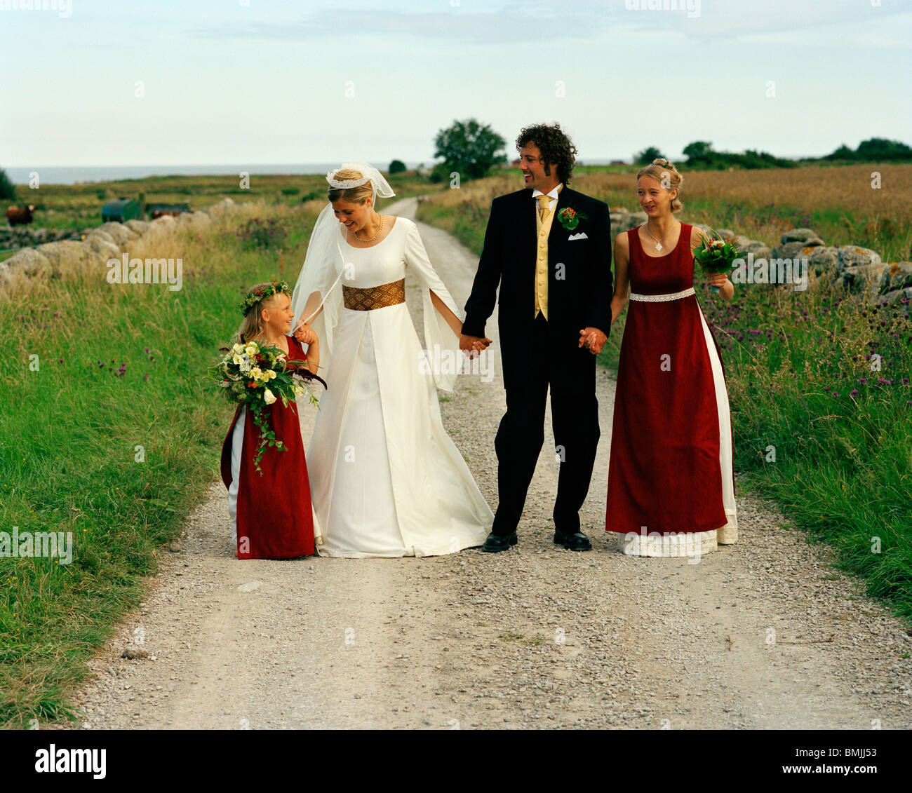 Scandinavia, Sweden, Oland, Bride and groom with bridesmaid and flower girl Stock Photo