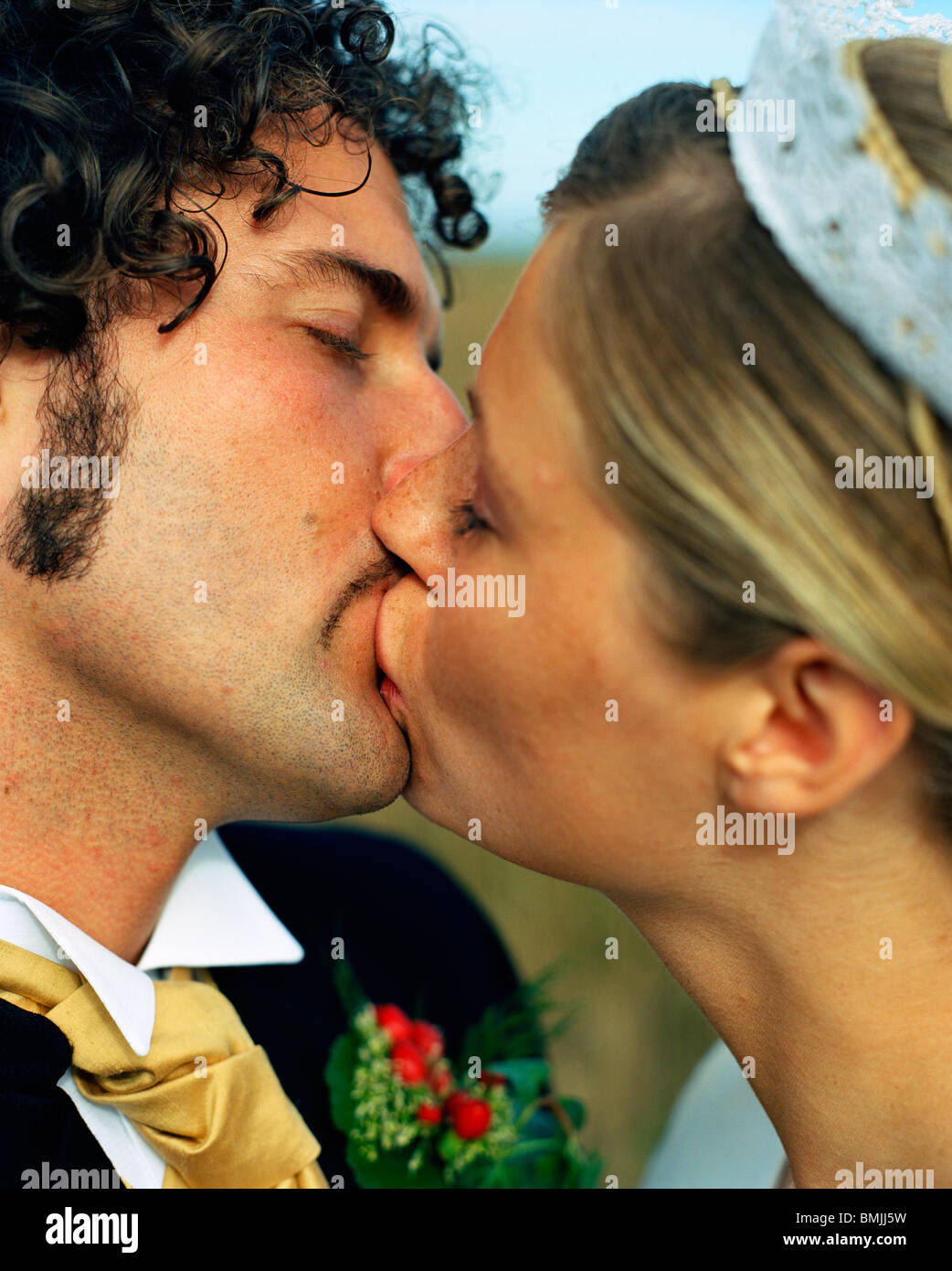 Scandinavia, Sweden, Oland, Bride and groom kissing, close-up Stock Photo