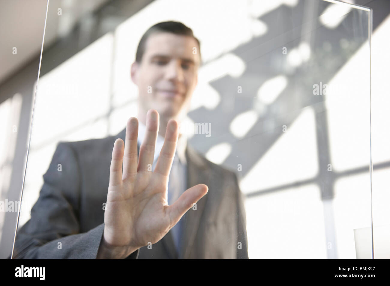 Businessman using touchscreen Stock Photo - Alamy