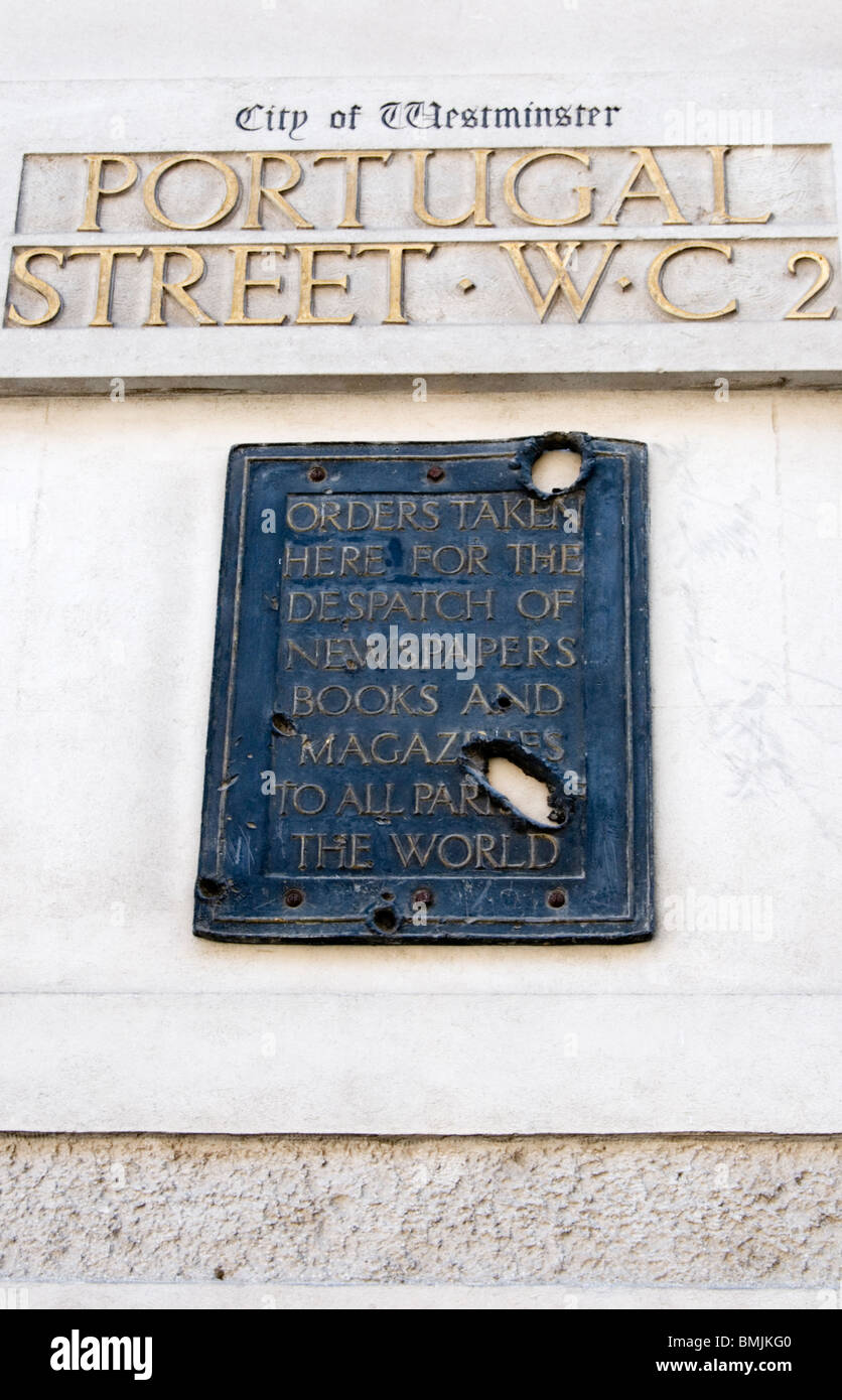 Shrapnel damaged sign in Portugal Street, London - full details in Description Stock Photo