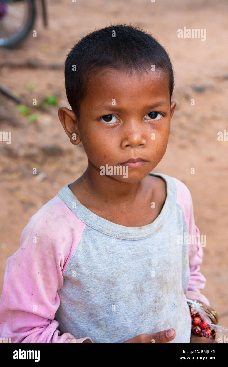 Cambodian child street vendor in angkor wat Stock Photo