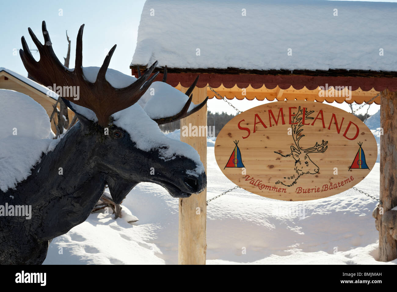 Scandinavia, Sweden, Harjedalen, Vemdalen, Snow covered statue of elk and signboard, close-up Stock Photo