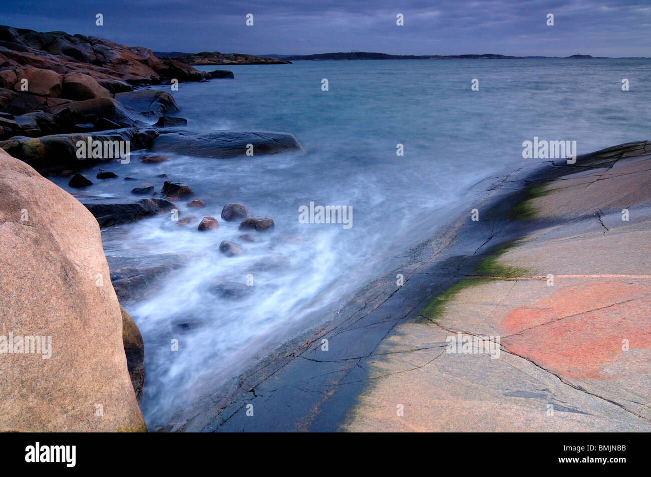 Flat rocks at the ocean Stock Photo - Alamy