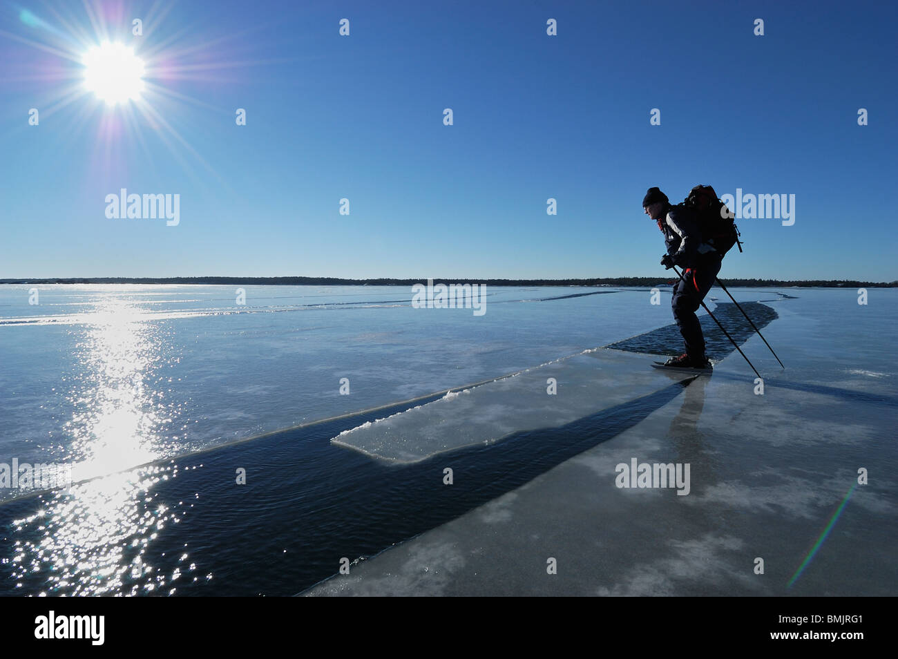A man ice skating on melting ice Stock Photo