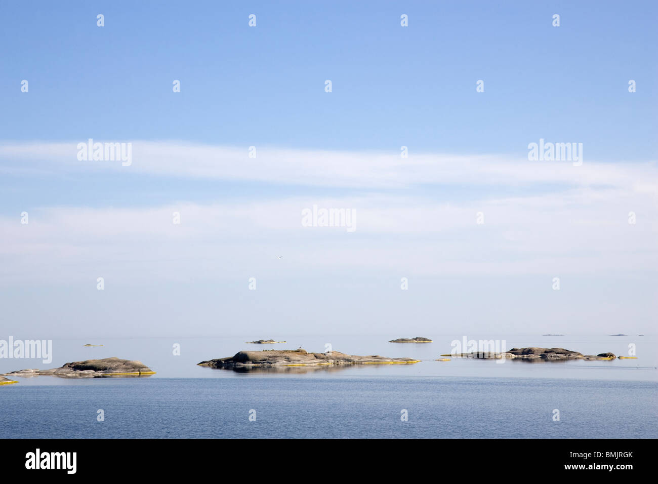 Flat rock in the ocean Stock Photo - Alamy