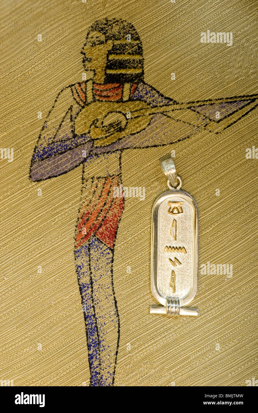 Egypt. Egyptian cotton printed textile, gold & sliver cartouche with typical hieroglyphic symbols. PR Stock Photo