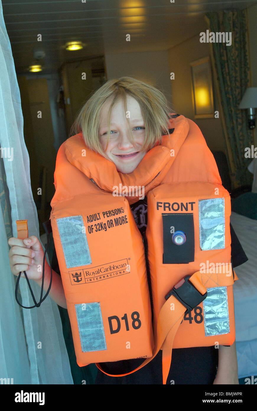 Boy in lifejacket on cruise ship Stock Photo Alamy