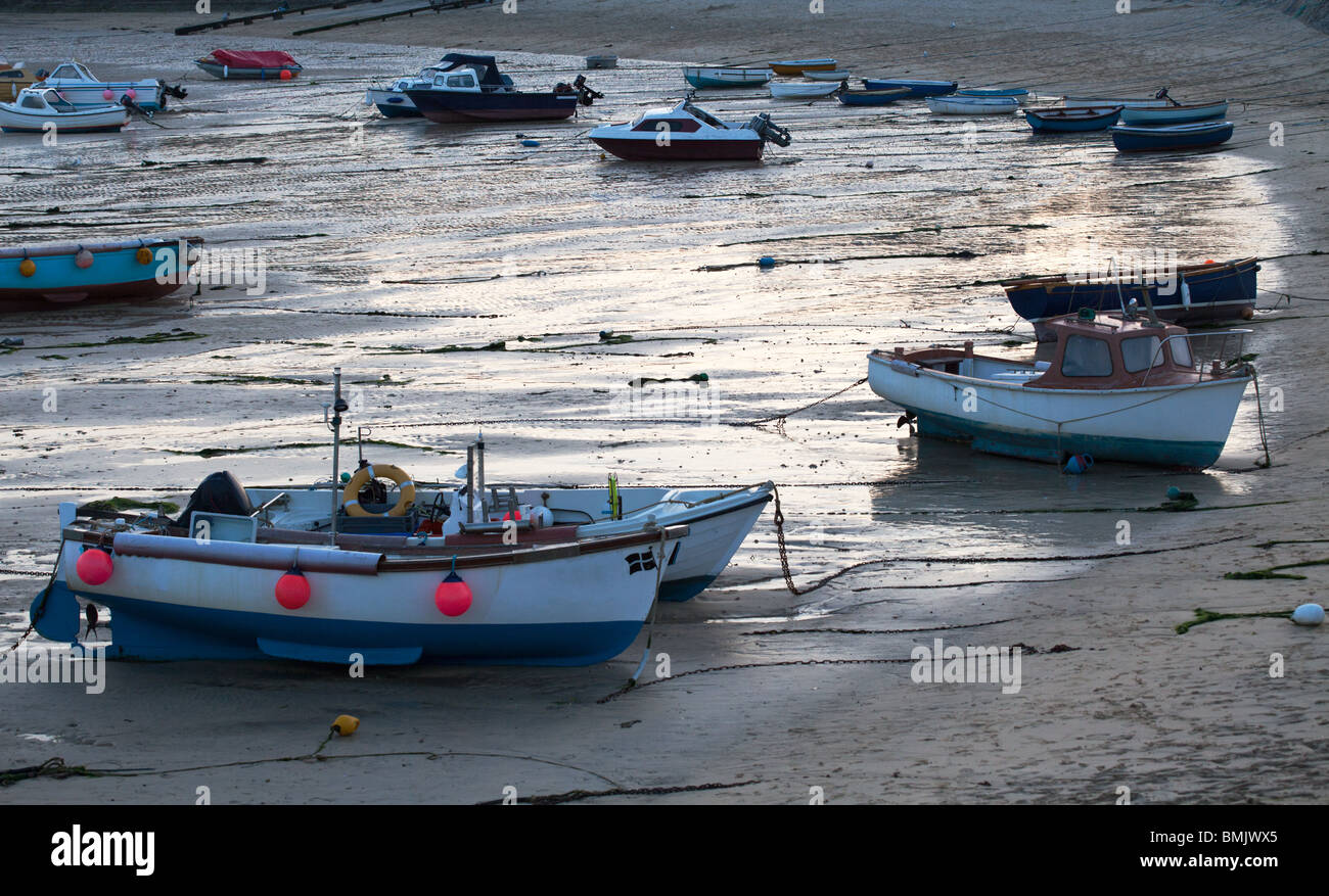 Boats and retreating tide in St Ives, early evening. Cornwall, England. Stock Photo