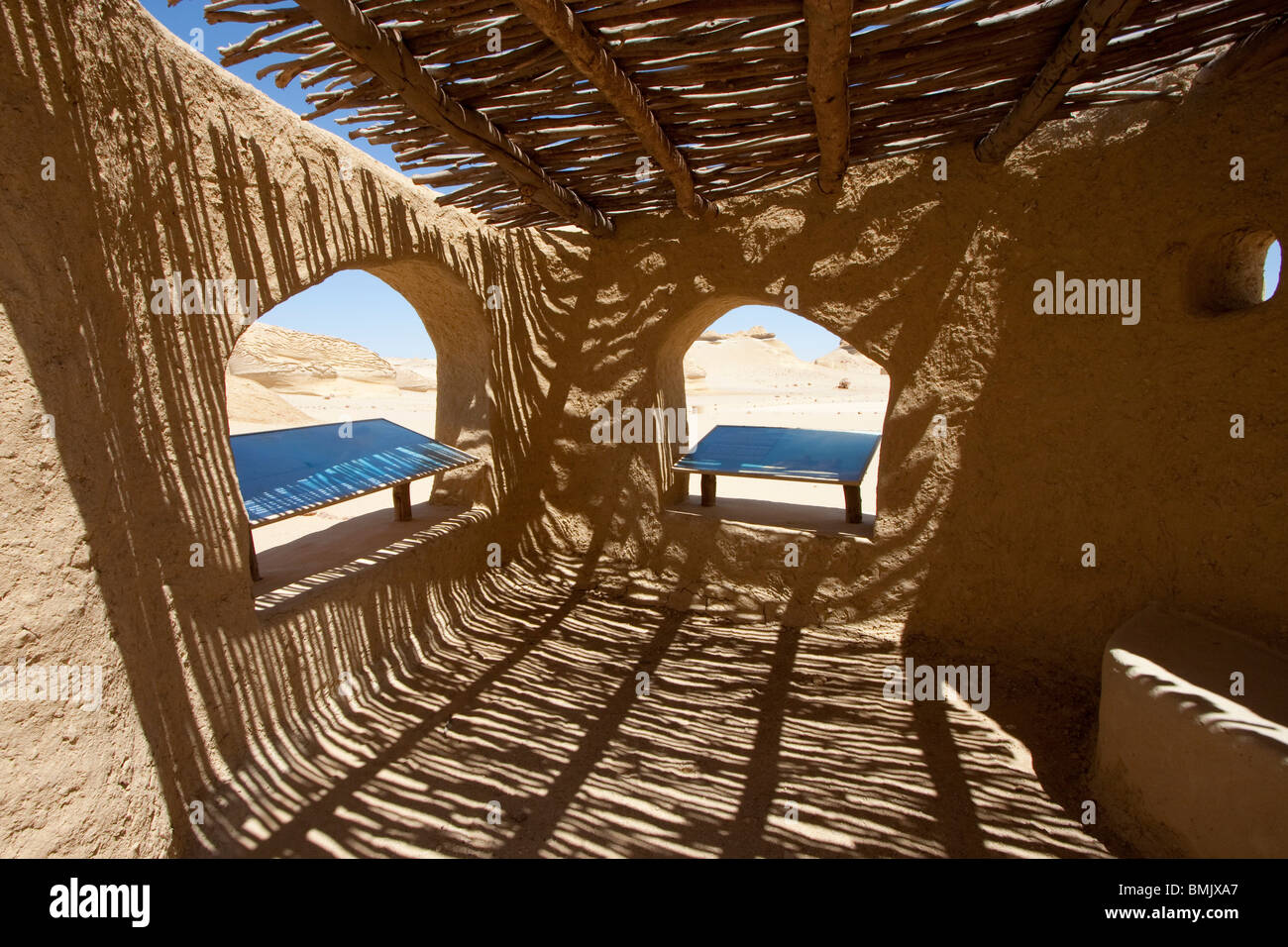 Shaded rest area with explanatory signs in Wadi Al-Hitan (Whale Valley), El Fayoum, Egypt Stock Photo