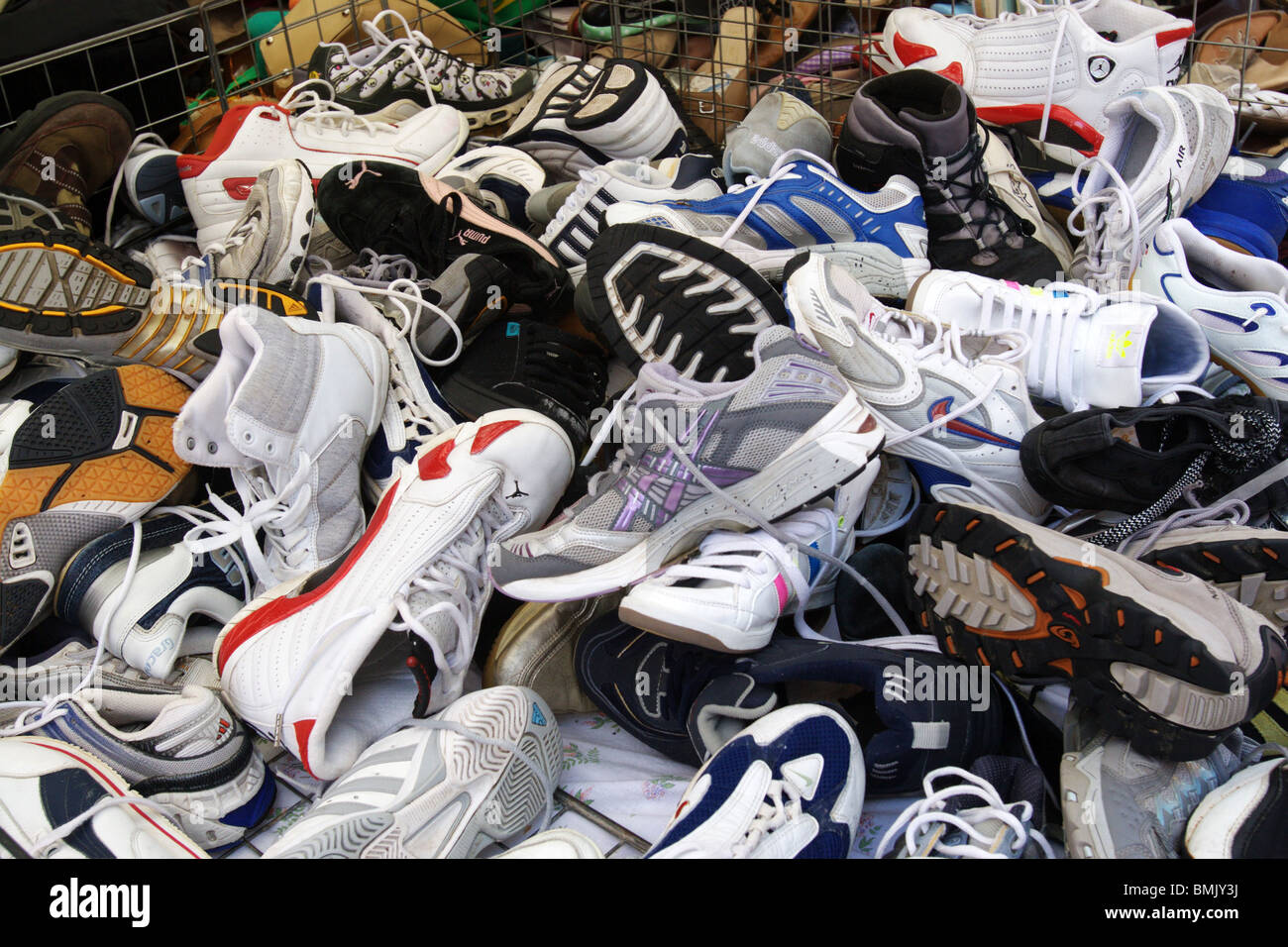 Stack of shoes at market stall hi-res stock photography and images - Alamy