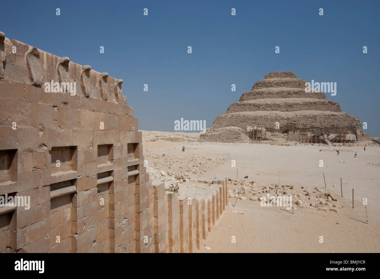 Cobra Wall of the South Tomb and Step Pyramid of Djoser, Saqqara, Al Jizah, Egypt Stock Photo