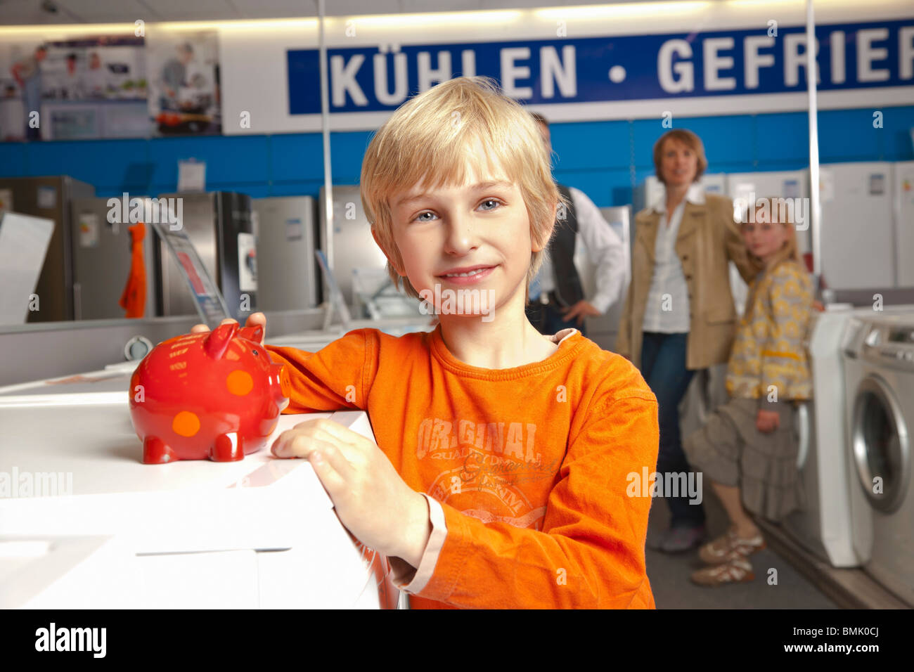 Boy with piggy bank Stock Photo