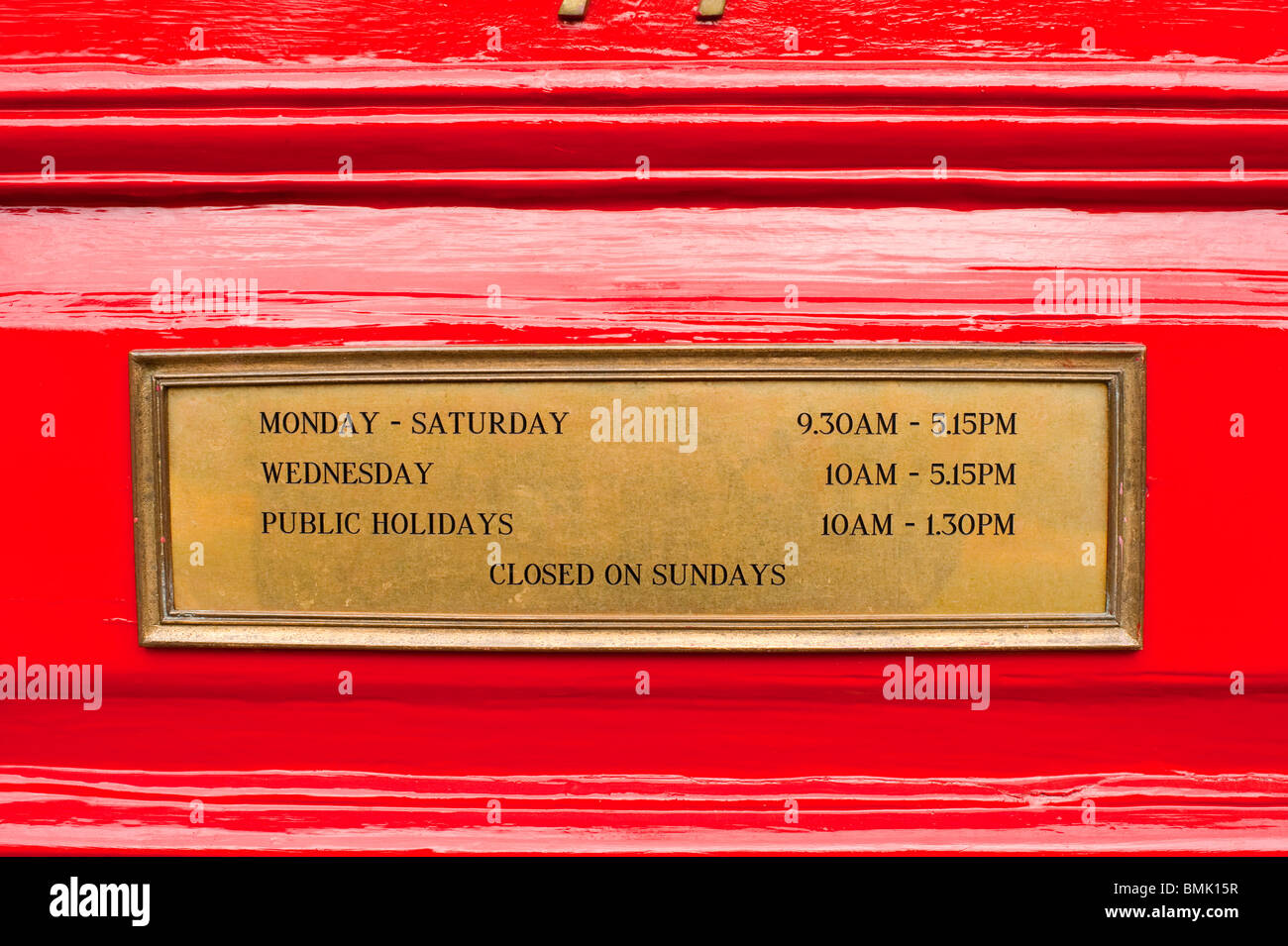 Opening Hours Brass Sign On Red Door Stock Photo 29921523