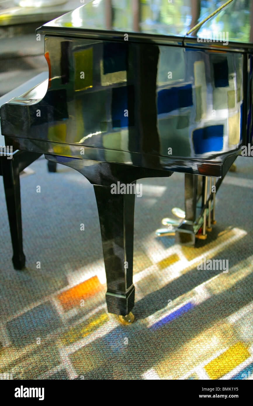 Piano With Stained Glass Reflection Stock Photo