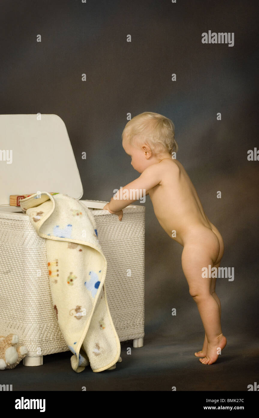  toddler naked Portrait of a naked toddler playing in the hamper Stock Photo - Alamy