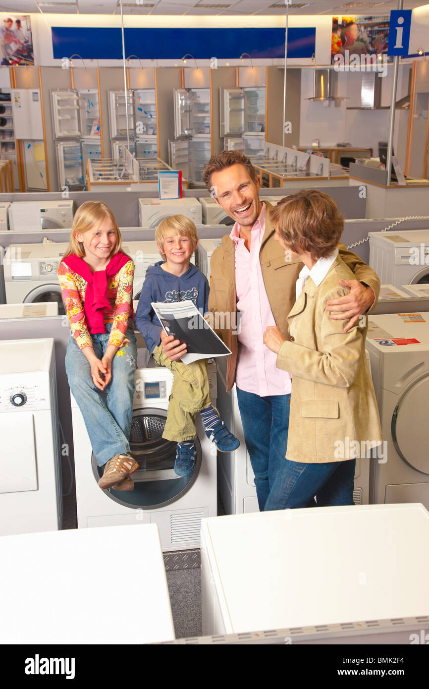 Family is happy about their new purchase Stock Photo