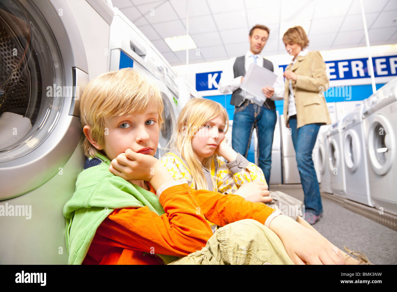 Children are bored of washing machines Stock Photo Alamy