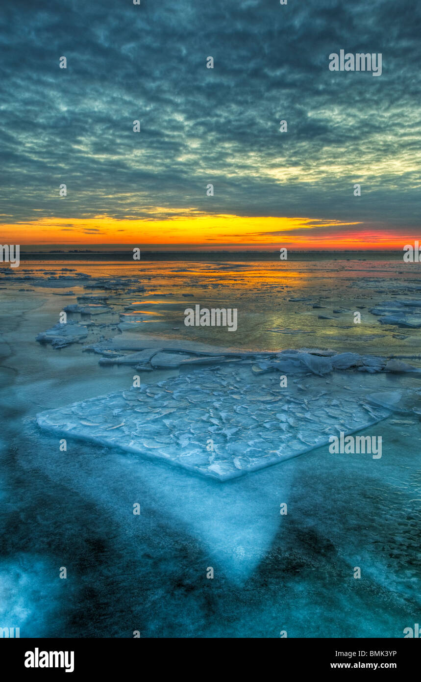 The dramatic landscape of a frozen Lake St. Clair in early morning twilight Stock Photo