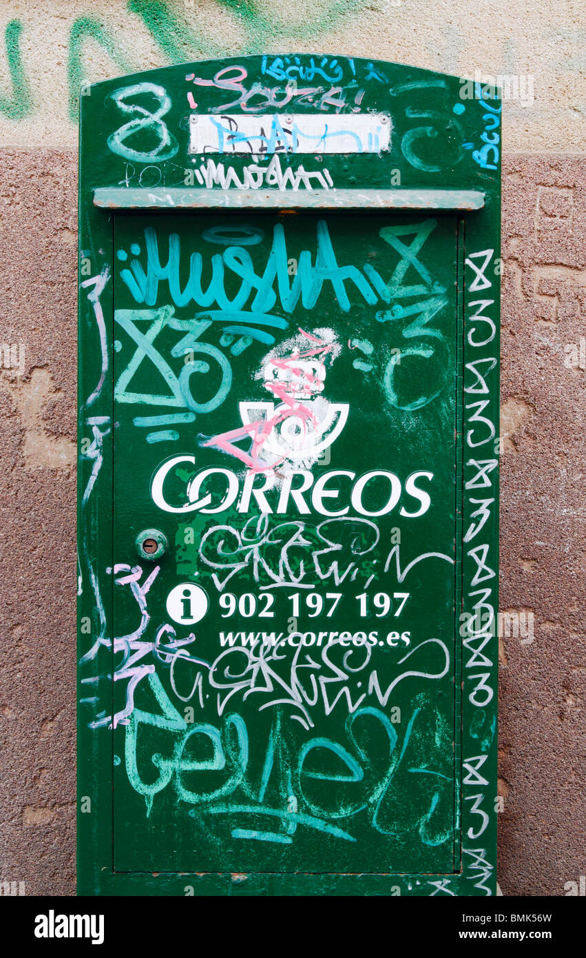 Spanish post box covered in graffiti Stock Photo