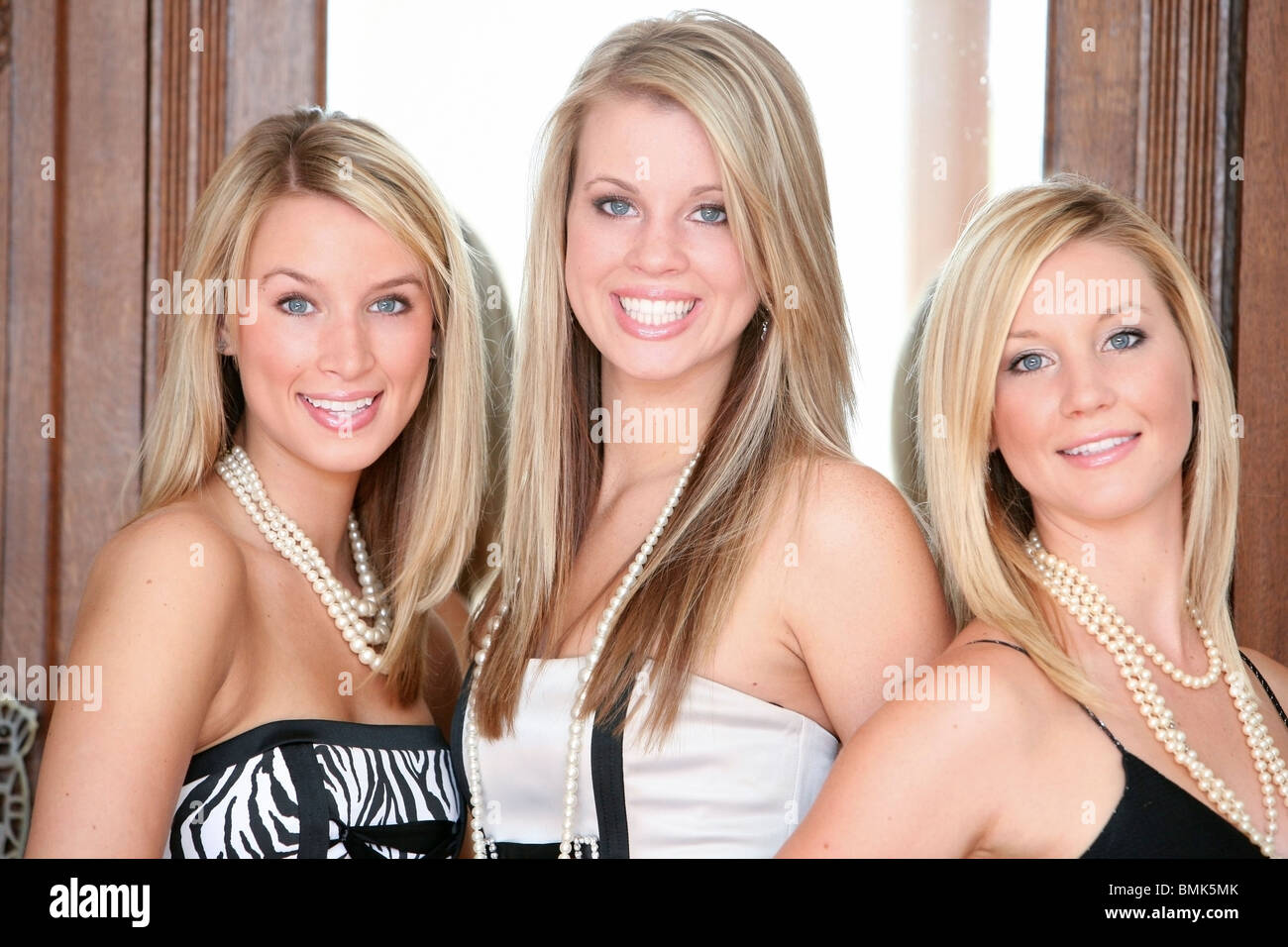 Three Teenage Girls In Formal Wear Stock Photo