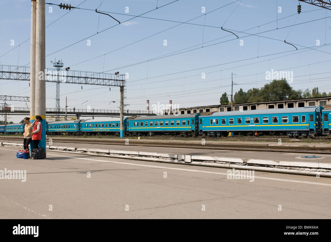 Railway station of Almaty with passengers and trains, Kazakhstan Stock Photo