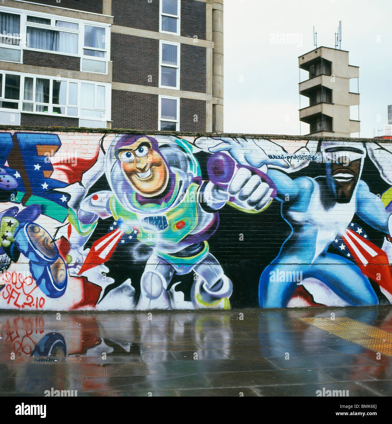 Buzz Lightyear and Captain America mural on a hoarding near a housing estate in East London England UK Stock Photo