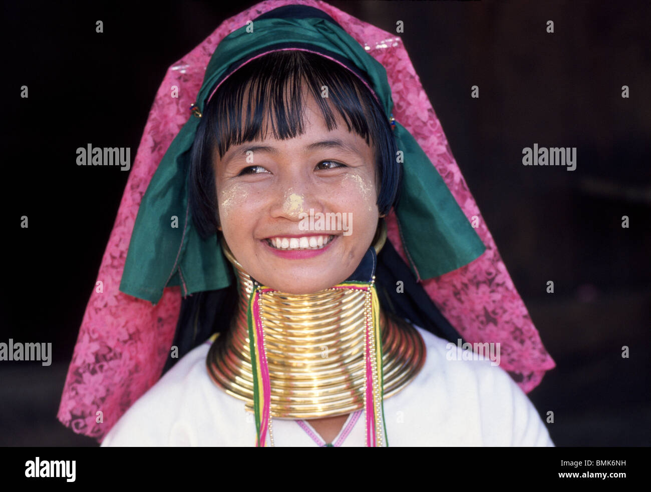 Some women of the Karen Paduang 'long neck' hill tribes in northern Thailand are easily identified by the brass rings coiled around their necks. Stock Photo