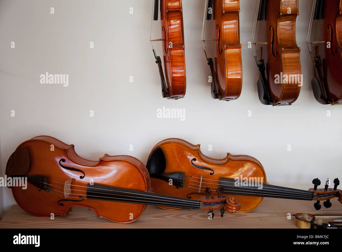 Finished hand made violins and violas Stock Photo Alamy