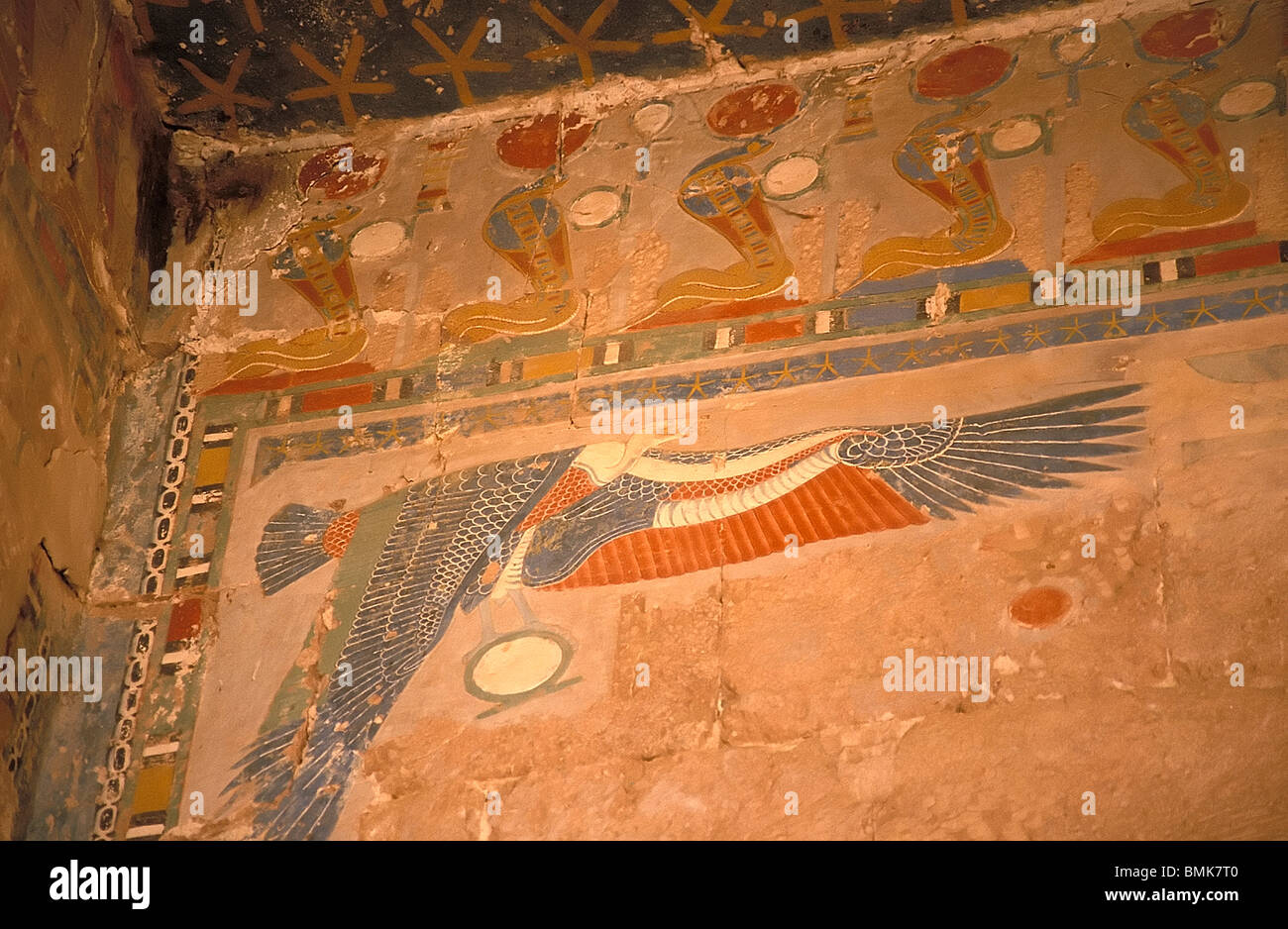 Painting of cobras and a bird in a corner of the Chapel of Anubis in the Hatshepsut Temple in Thebes , Qina, Egypt Stock Photo