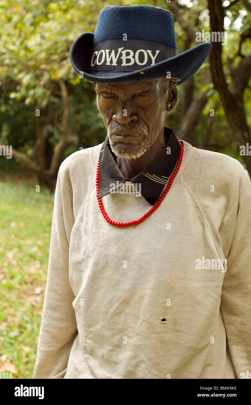 Ethiopia, Omo Region, Tulgit. Suri man wearing cowboy hat inscribed with cowboy. Stock Photo