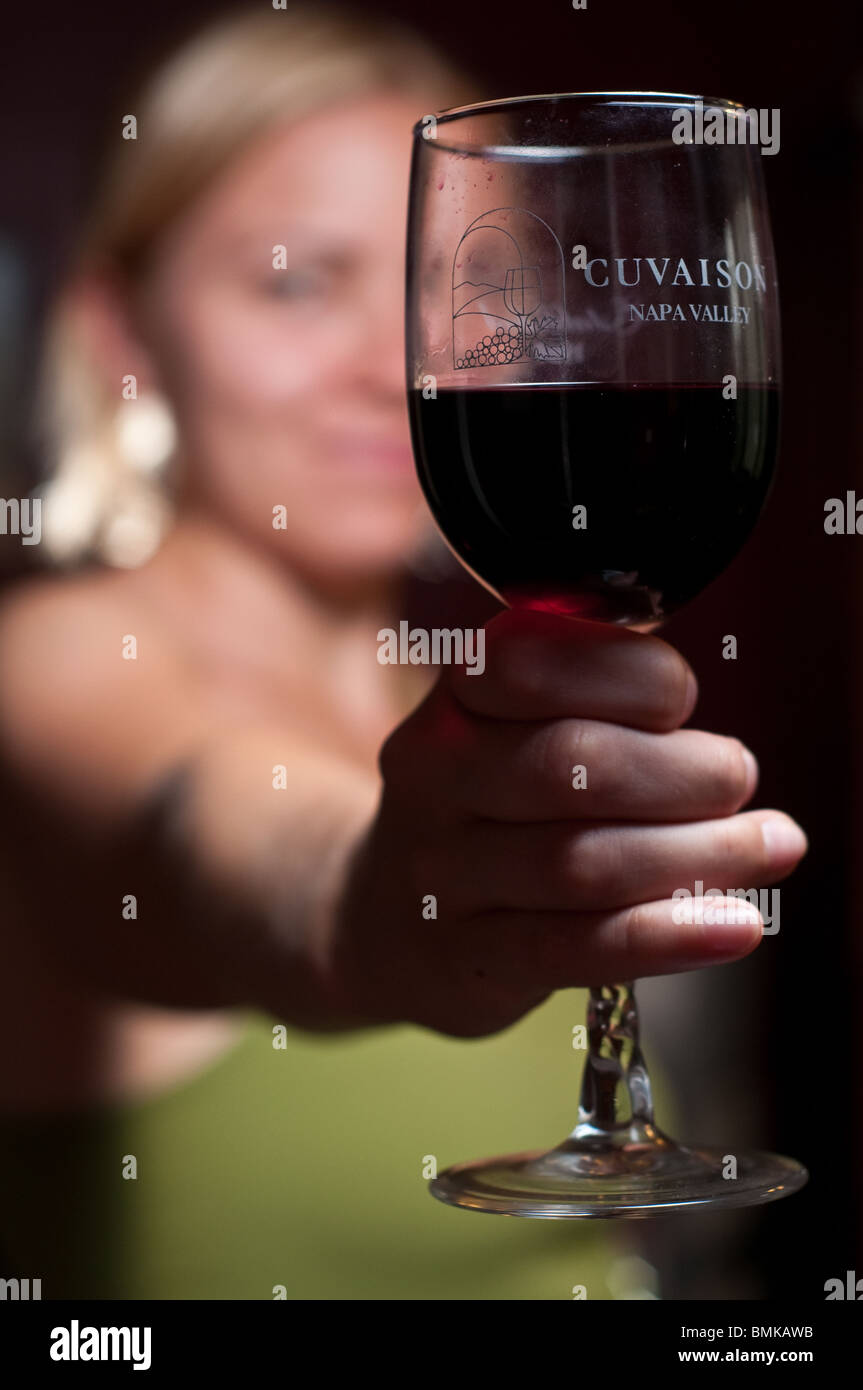 Young woman enjoying a glass of wine Stock Photo - Alamy