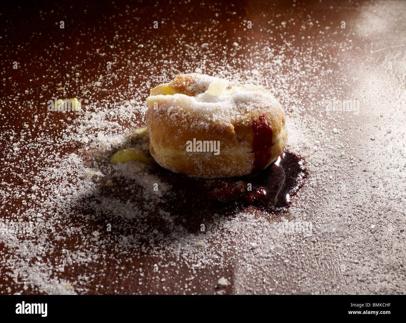 Doughnut with jam and custard Stock Photo Alamy