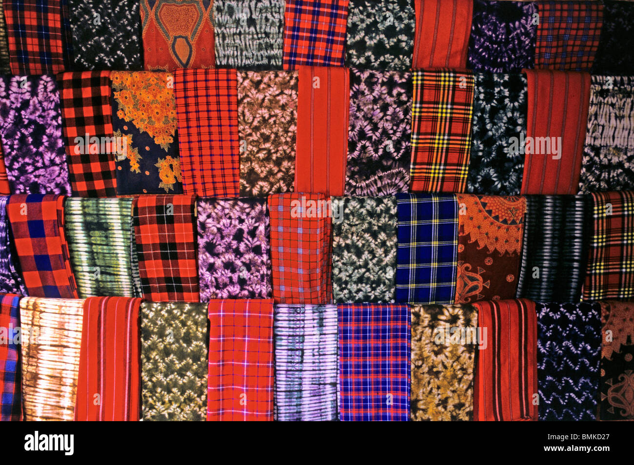 Africa, Kenya, Maasai Mara. A colorful display of fabrics and cloth of
