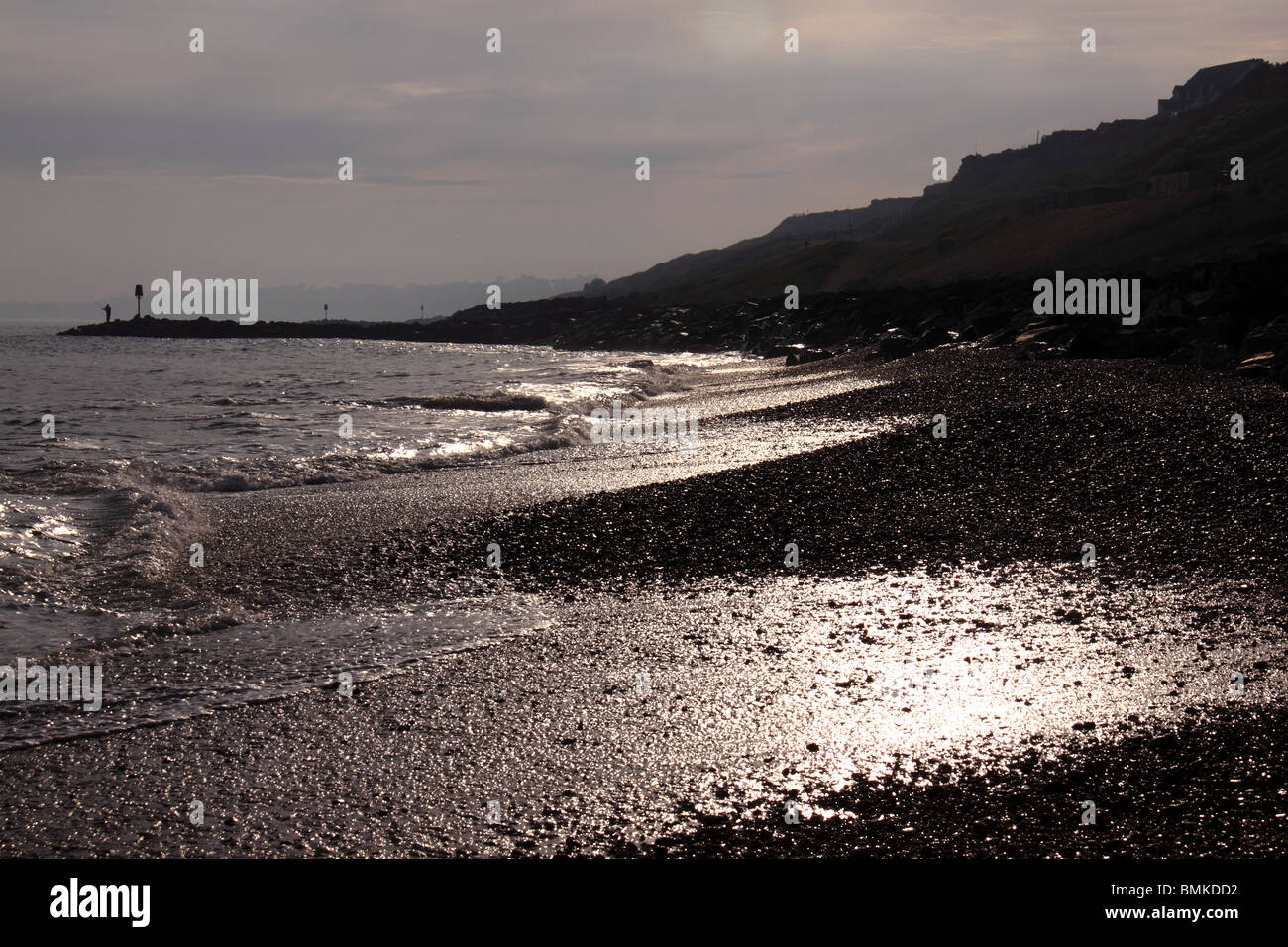 sunshine on pebble beach of Barton on Sea Stock Photo Alamy