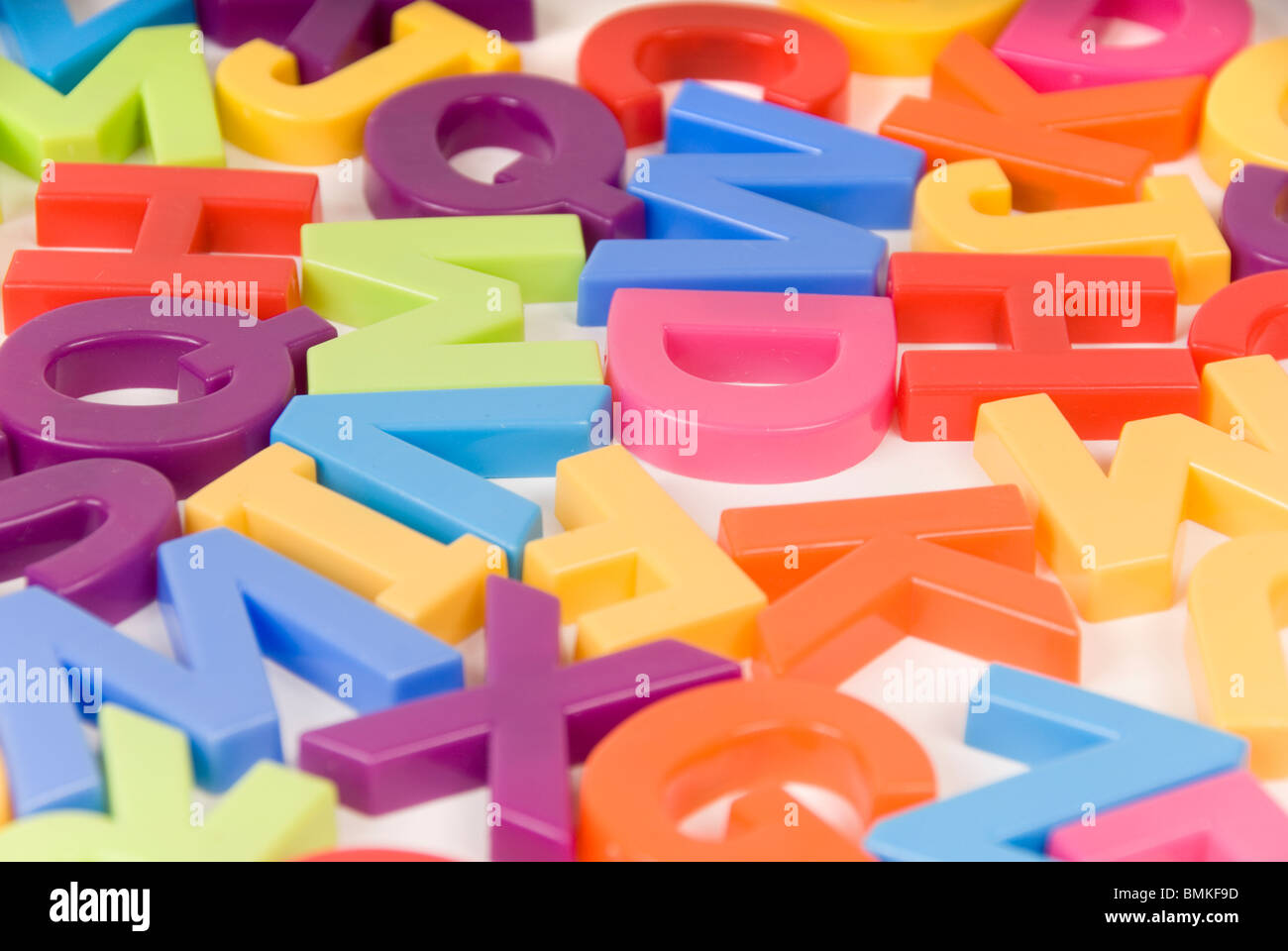 Brightly Colored Childrens Toy Alphabet Letters on White