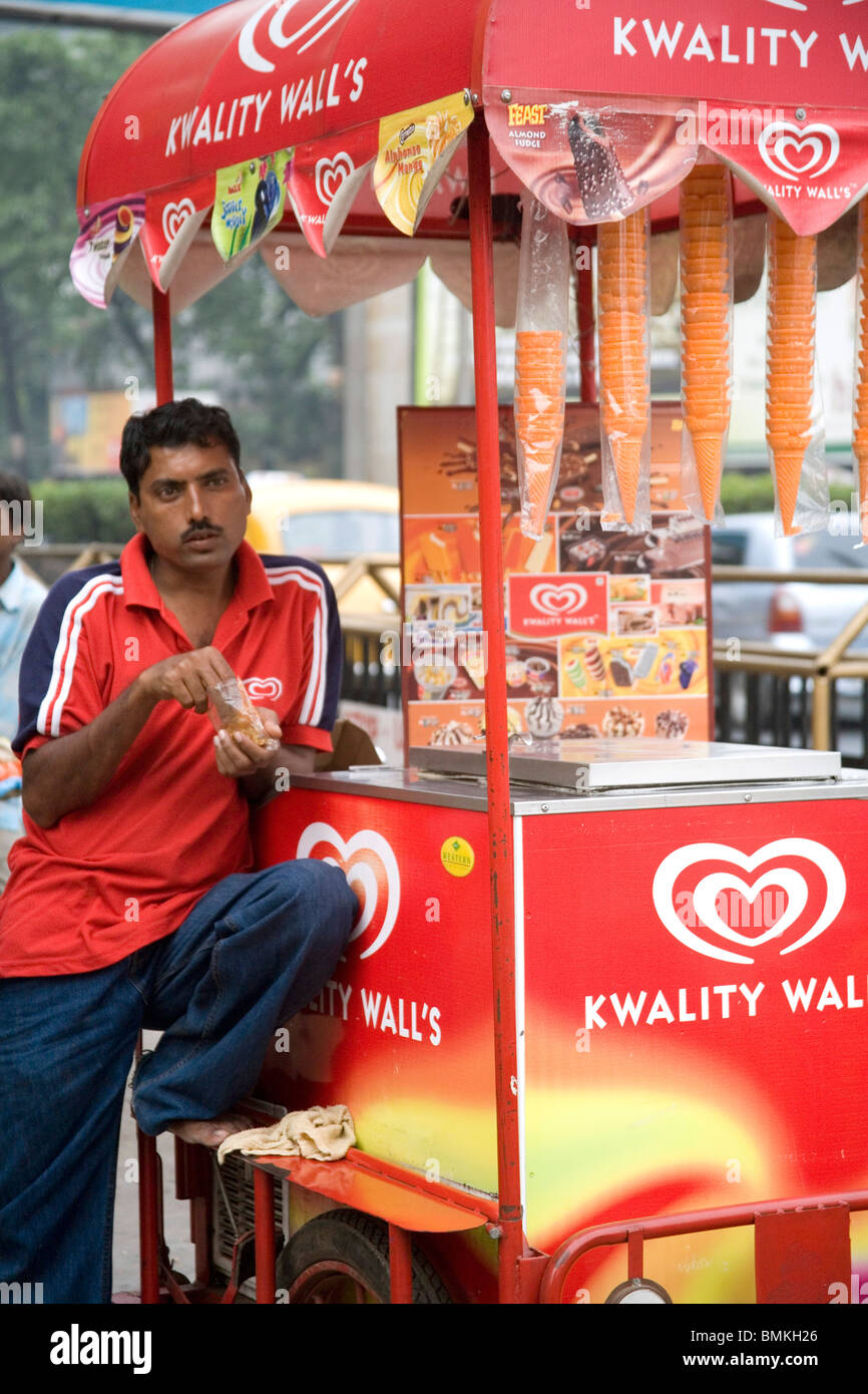 Ice cream vendor standing with cart out side at zoo ; Calcutta now Kolkata ; West Bengal ; India Stock Photo